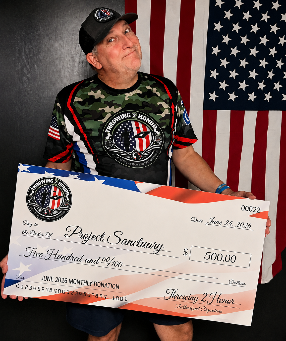 Throwing 2 Honor presenting a 500 dollar donation check to Project Sanctuary on June 24, 2026